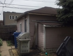 Pre-foreclosure in  W WELLINGTON AVE Chicago, IL 60641