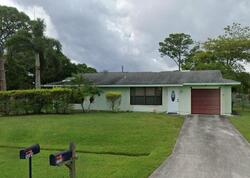 Pre-foreclosure in  SW AVENS ST Port Saint Lucie, FL 34983