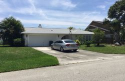 Pre-foreclosure in  RAINWOOD CIR W Palm Beach Gardens, FL 33410