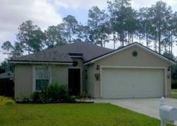 Pre-foreclosure in  WELLWOOD LN Palm Coast, FL 32164
