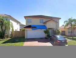 Pre-foreclosure in  NW 194TH ST Hialeah, FL 33015
