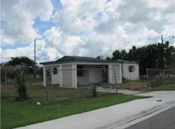 Pre-foreclosure in  SW 12TH AVE South Bay, FL 33493
