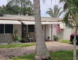 Pre-foreclosure in  NE 14TH TER Pompano Beach, FL 33064