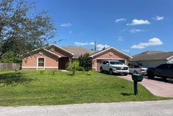 Pre-foreclosure in  SW JANETTE AVE Port Saint Lucie, FL 34953