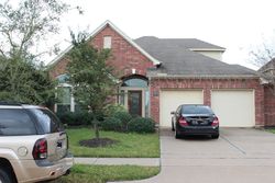 Pre-foreclosure in  WHISPY GREEN CT Cypress, TX 77433