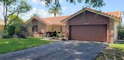 Pre-foreclosure in  NW 21ST PL Pompano Beach, FL 33071