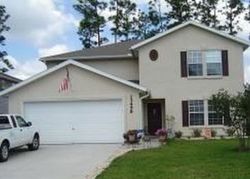Pre-foreclosure in  ASHFORD WOOD CT W Jacksonville, FL 32218