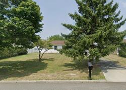 Pre-foreclosure in  THRASHER AVE Bellport, NY 11713