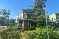 Pre-foreclosure in  W MOSHER ST Baltimore, MD 21216