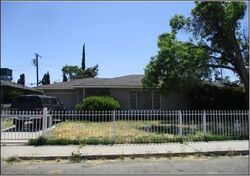 Pre-foreclosure in  E BRENTWOOD AVE Fresno, CA 93703
