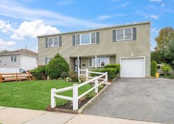 Pre-foreclosure in  MEADOW WOOD LN Farmingdale, NY 11735
