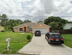 Pre-foreclosure in  SW HEATHER ST Port Saint Lucie, FL 34983