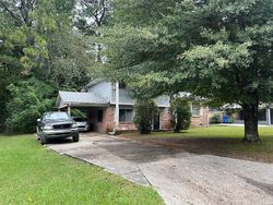 Pre-foreclosure in  WOODSTOCK DR SW Atlanta, GA 30331