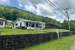 Pre-foreclosure in  RUSSELL HILL ST Grundy, VA 24614