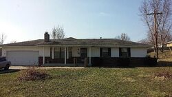 Pre-foreclosure in  E 107TH ST Kansas City, MO 64134