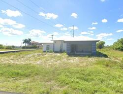 Pre-foreclosure in  NW 10th St Cape Coral, FL 33993