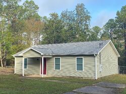 Pre-foreclosure in  GILMORE RD Holt, FL 32564