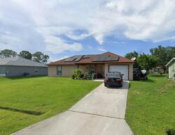 Pre-foreclosure in  Se Dalva Ave Port Saint Lucie, FL 34984