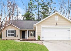 Pre-foreclosure in  Walnut Crossing Dr Whitsett, NC 27377