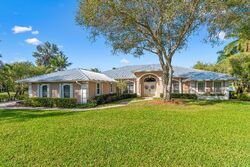 Pre-foreclosure in  Sw Orchid Bay Dr Palm City, FL 34990
